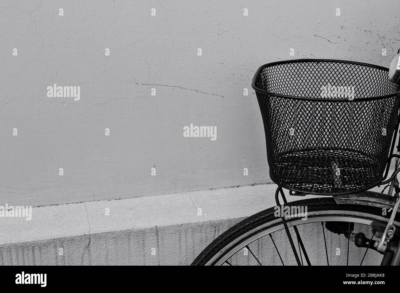 Metallic black basket of an old rusted bike (Pesaro, Italy, Europe) Stock Photo