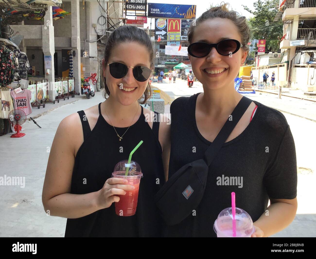 Bangkok, Thailand. 22nd Mar, 2020. Bonn holidaymakers Anna von Jagemann (l) and Luisa Friese are standing in Bangkok's backpacker district on Khao San Road. (To dpa 'Off home - impressions from a famous backpacker quarter') Credit: Caroline Bock/dpa/Alamy Live News Stock Photo