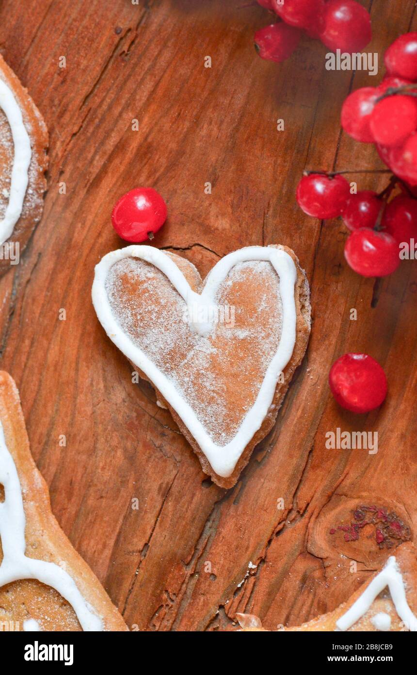 Love concept with red berries and cookies in the form of heart. Ripe ...