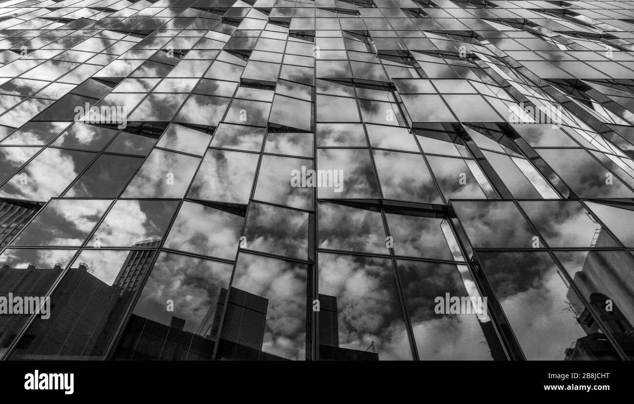 Reflections in the windows of an office building in Osaka, Japan Stock Photo