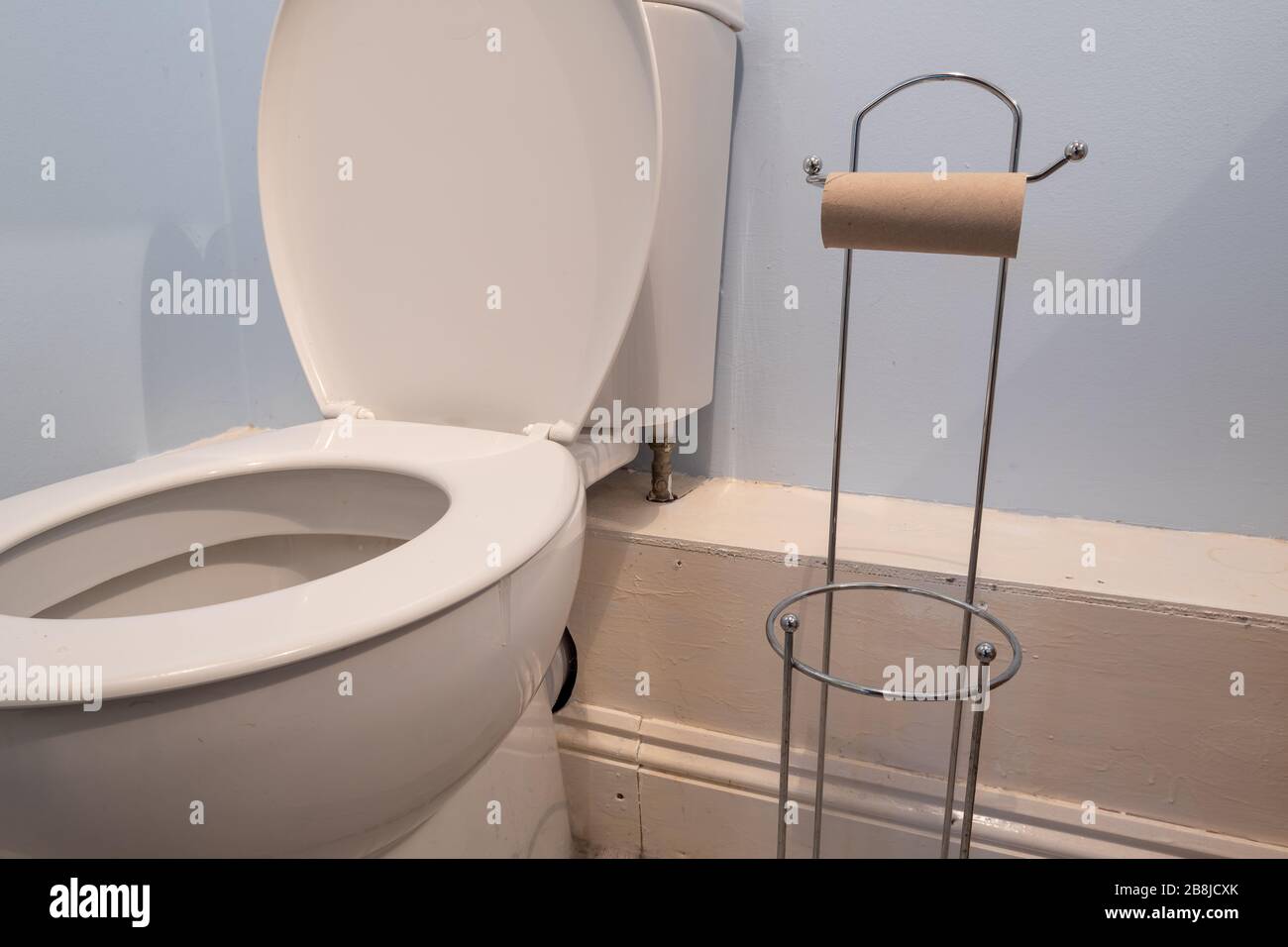Close up of an empty toilet roll holder due to a shortage of toilet paper Stock Photo Alamy