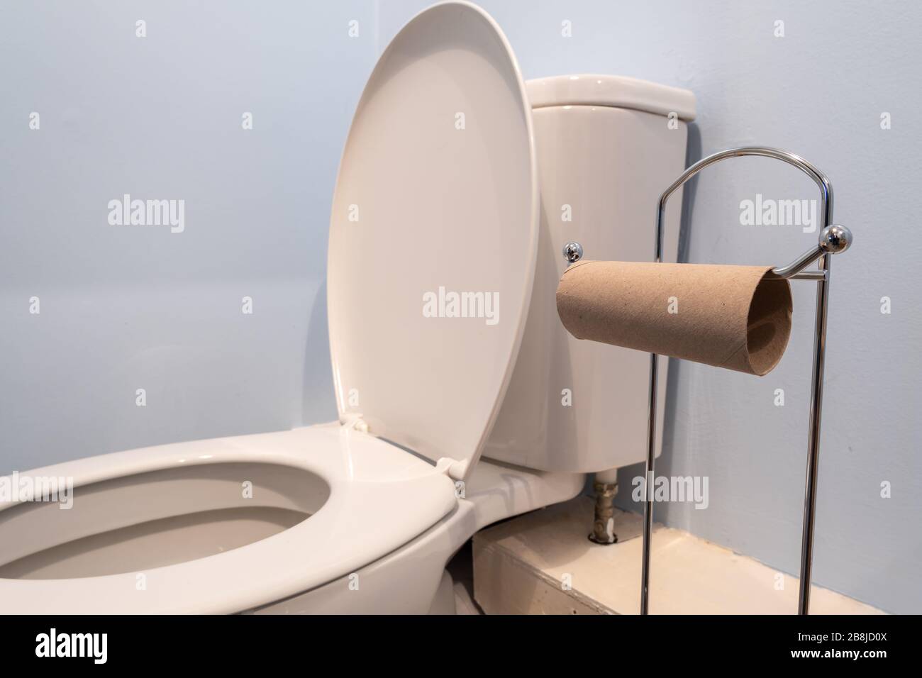 Close up of an empty toilet roll holder due to a shortage of toilet paper Stock Photo Alamy