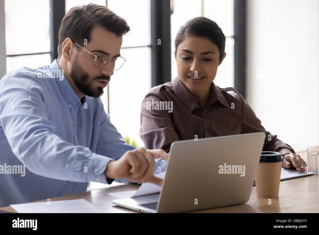Diverse colleagues brainstorm business ideas working on laptop Stock ...