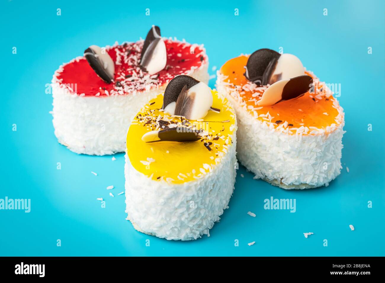 Cakes with sprinkles, unhealthy highcalorie food. Coconut flakes on