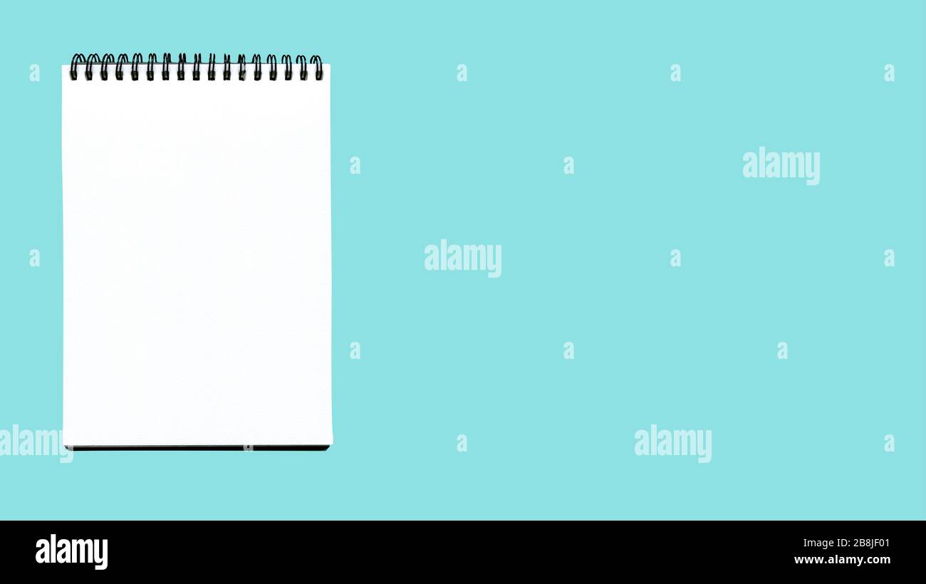 Open notebook isolated on blue. Blank notebook isolate Stock Photo