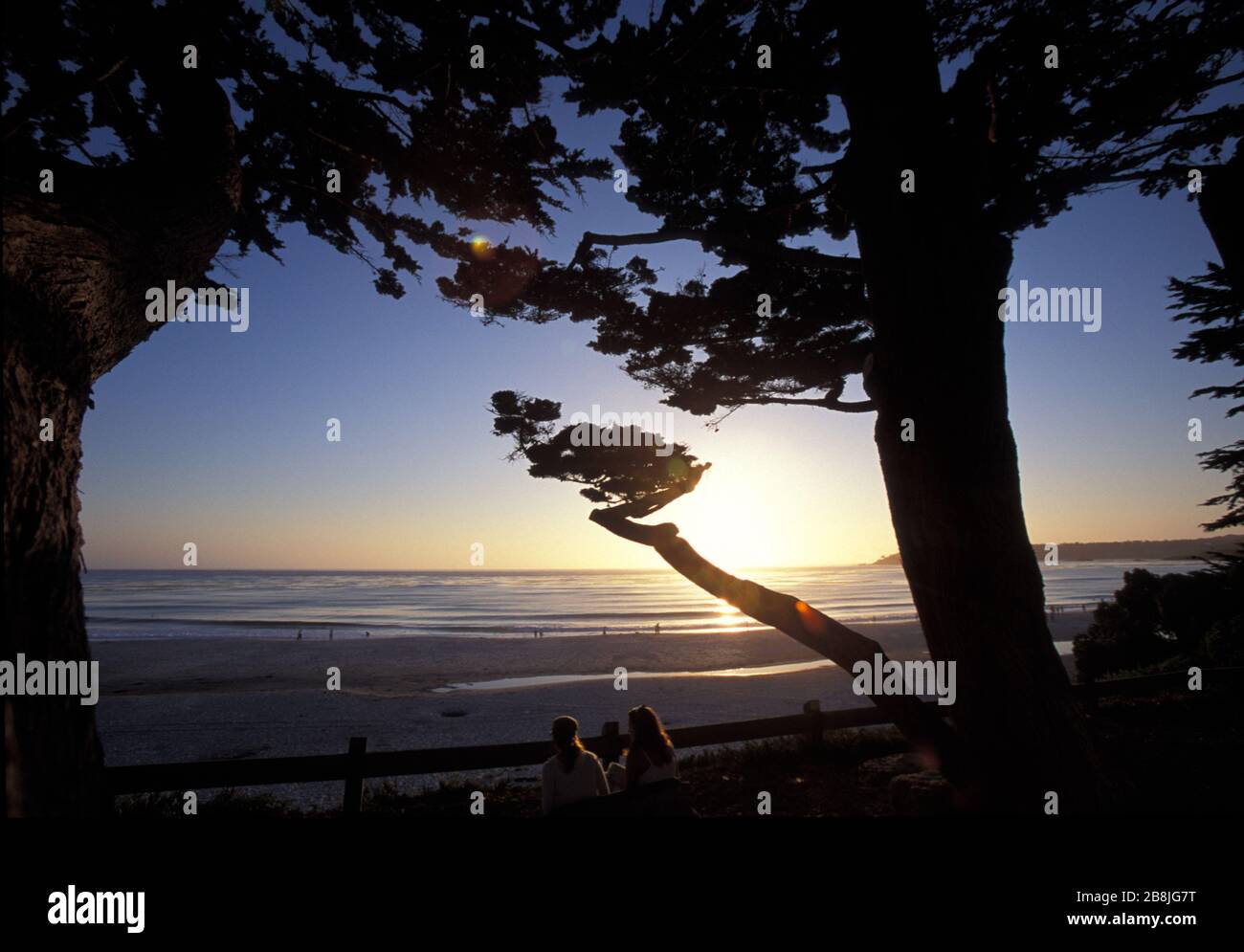 Couple watching the sunset, CarmelbytheSea, beach at sunset