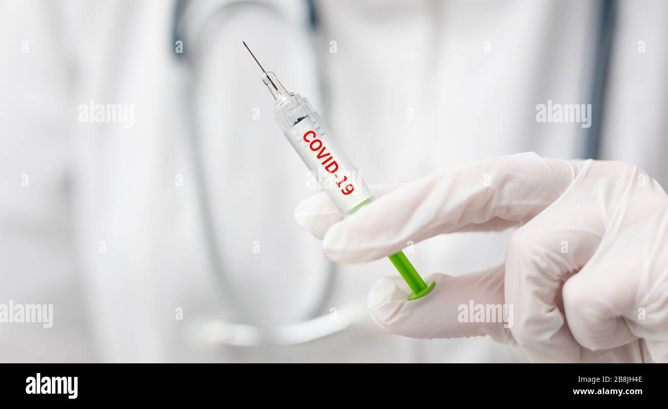 Vaccine and syringe injection for prevention and treatment from corona virus infection (novel coronavirus, COVID-19, nCoV 2019). Stock Photo