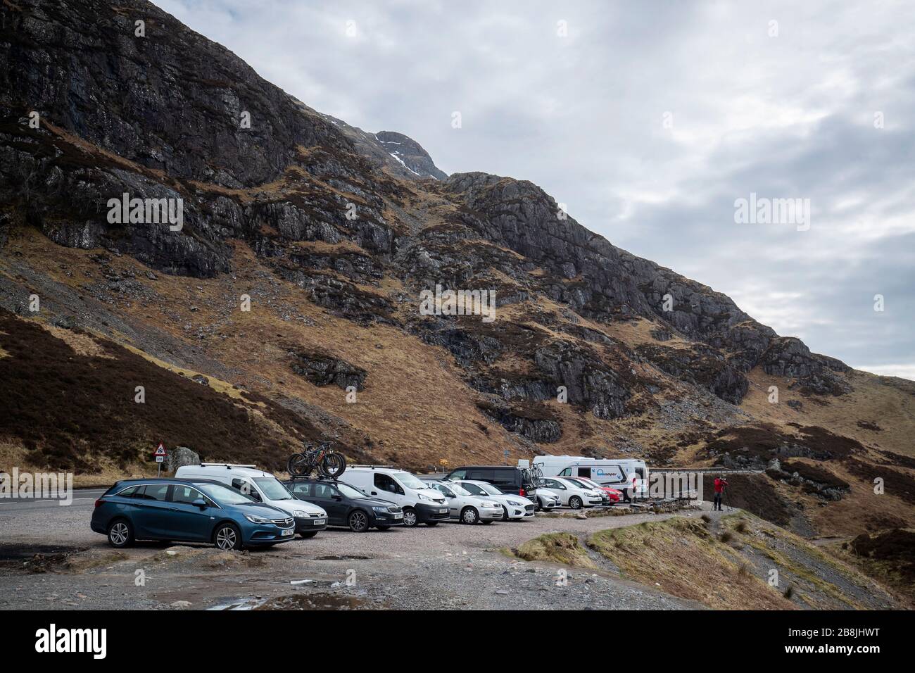 Cars and campervans parked in the Pass of Glencoe, Argyll and Bute. Stock Photo