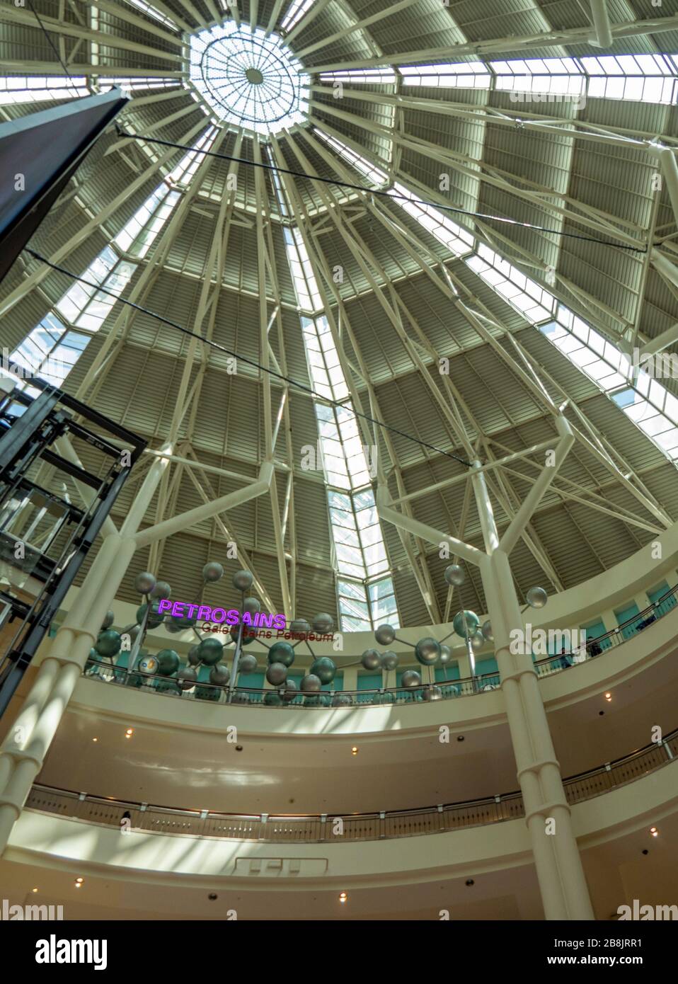 Dome roof over central atrium at Suria KLCC Shopping Mall at base of Petronas Towers Kuala Lumpur Malaysia. Stock Photo