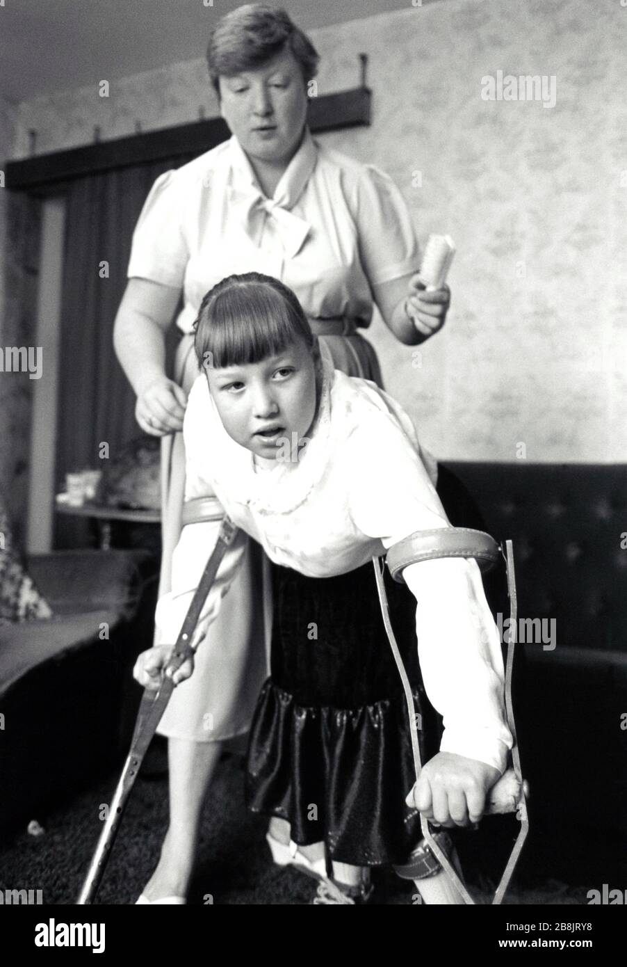 Disabled girl with her mother, UK 1990 Stock Photo