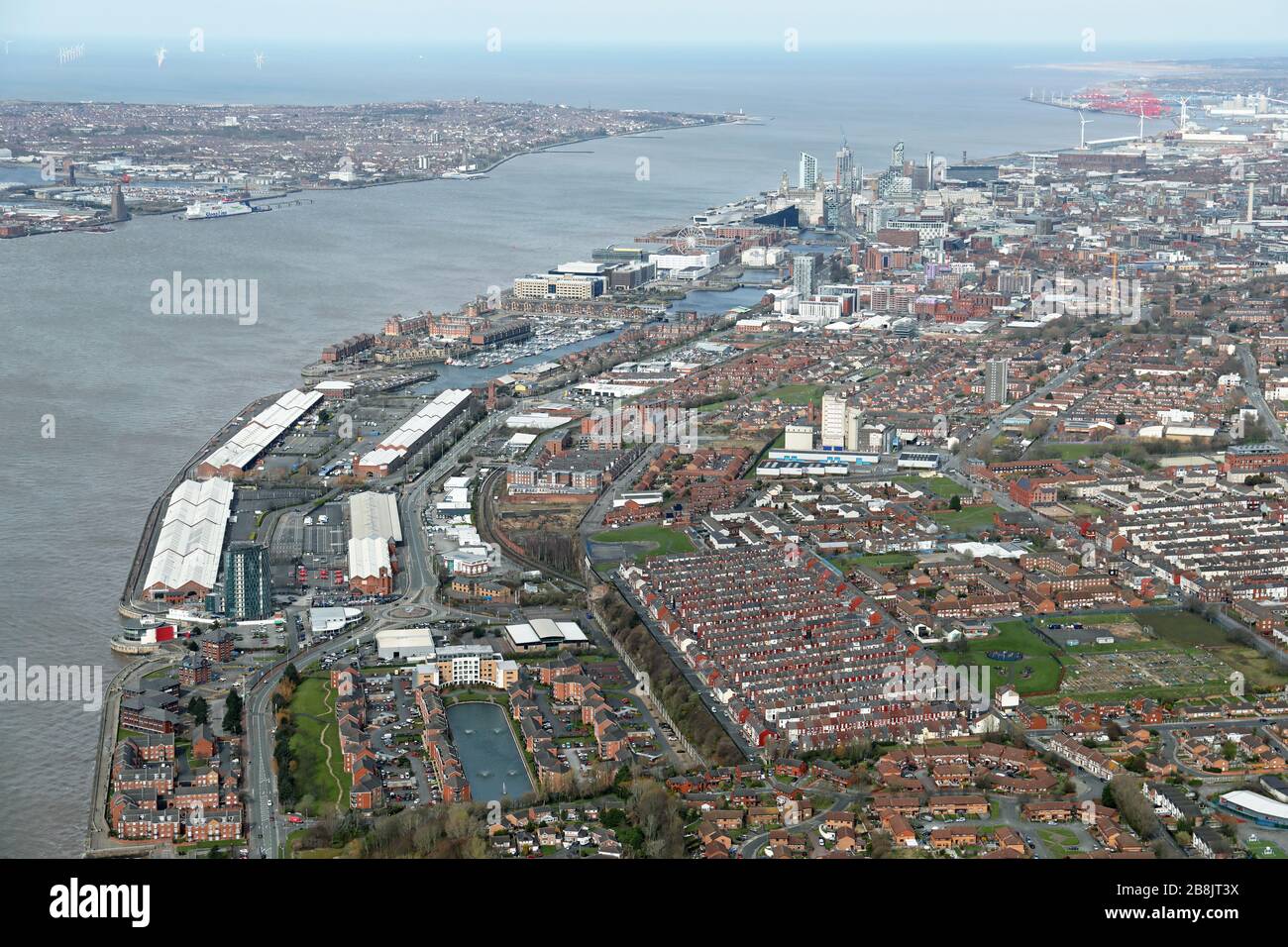 aerial view of Liverpool skyline with the Brunswick Business Centre & Spring City Trampoline Park in the foreground and Liver Building & Mersey behind Stock Photo