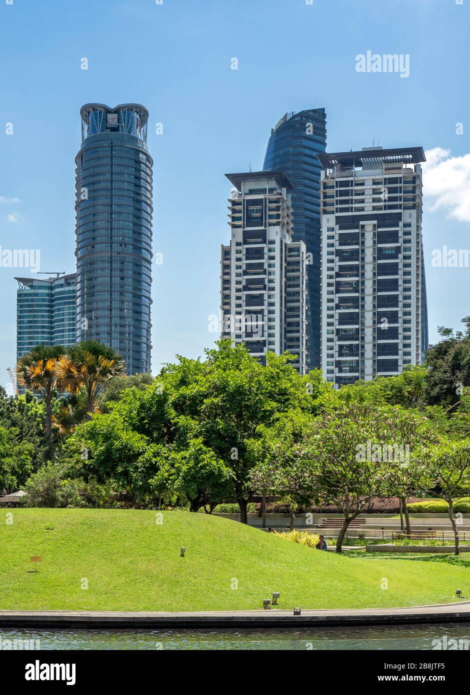 Office and residential high rise towers view from Lake KLCC Park Kuala Lumpur Malaysia. Stock Photo