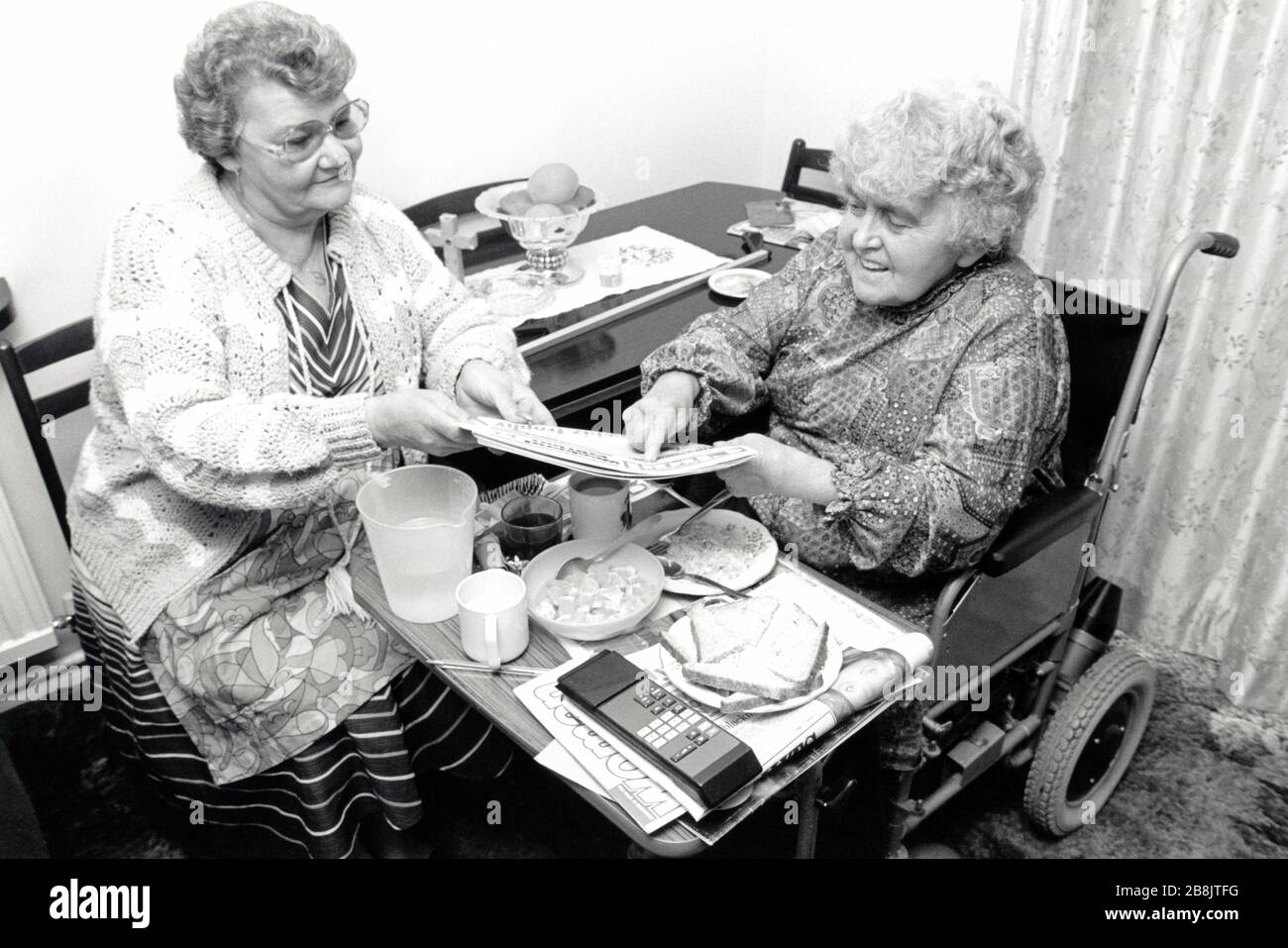 Carer & disabled elderly woman UK 1991 Stock Photo