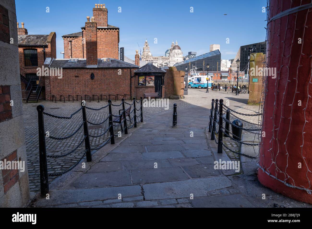 Liverpool, UK. March 22, 2020. Liverpool city centre in the north-west of England almost completely deserted after the Government in the United Kingdom ordered the shut down of all pubs and restaurants due to the worldwide Coronavirus pandemic. Some local services such as public transport has been scaled back in the city due to a reduction in passenger numbers. Credit: Christopher Middleton/Alamy Live News Stock Photo