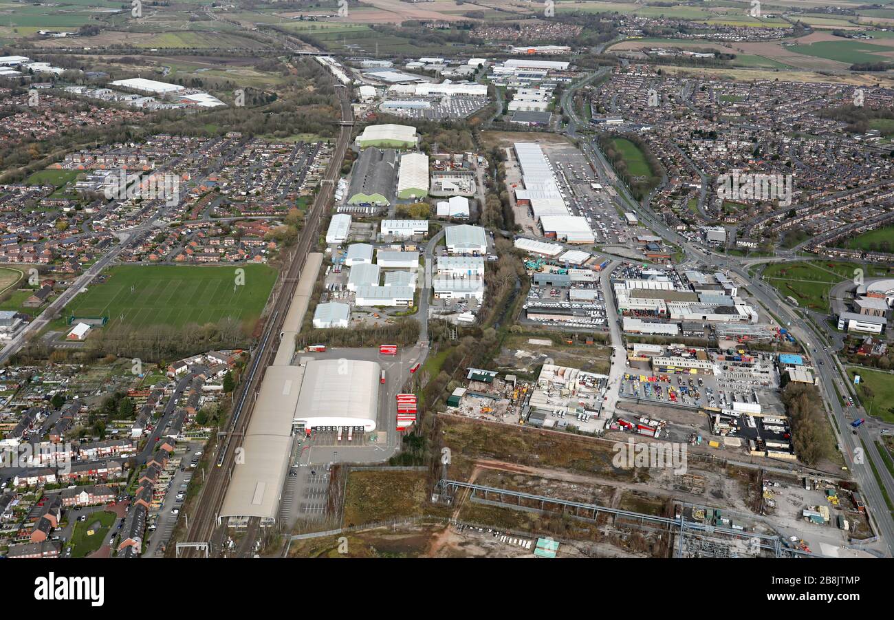 aerial view of industry and businesses alongside the A49 Warrington, looking north to junction 9 of the M62 motorway Stock Photo