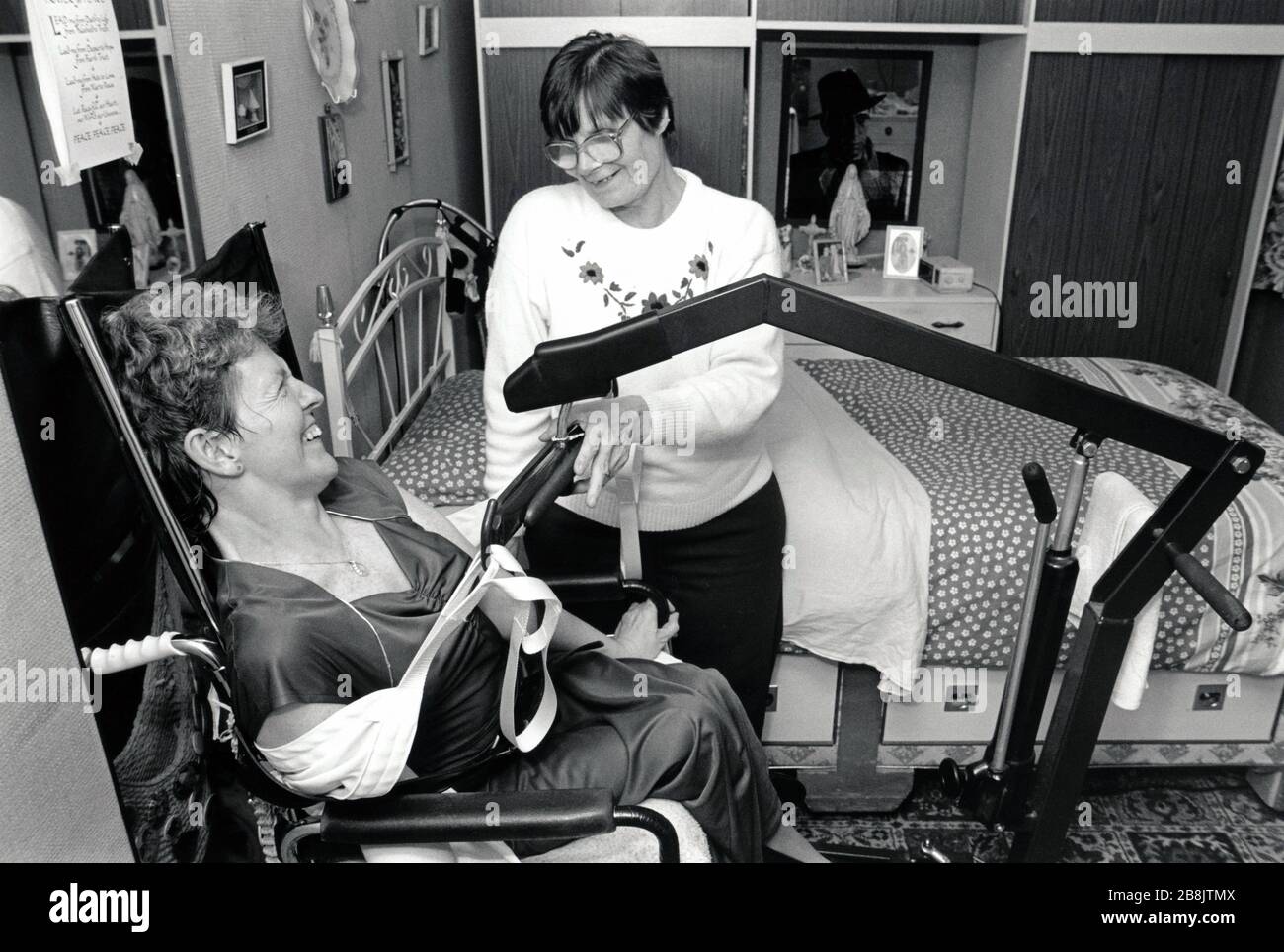 Carer with disabled woman UK 1990s Stock Photo