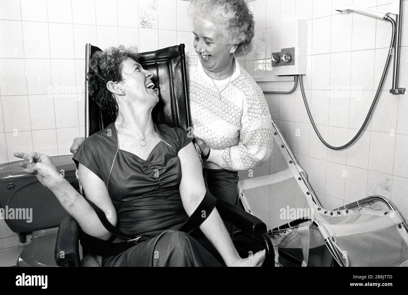 Carer with disabled woman UK 1990s Stock Photo