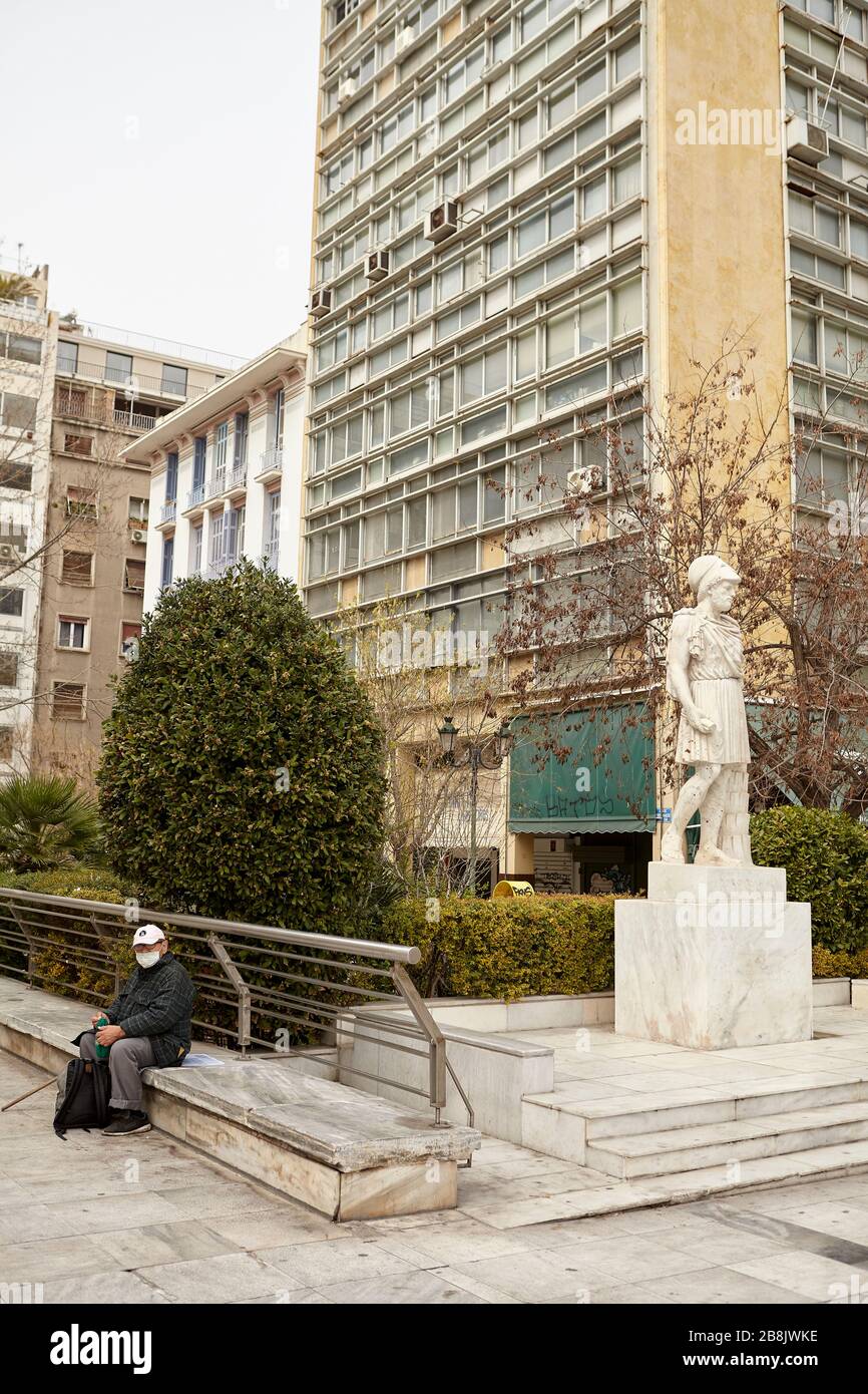 person wearing mask and Pericles statue ash Athens Greece Stock Photo ...