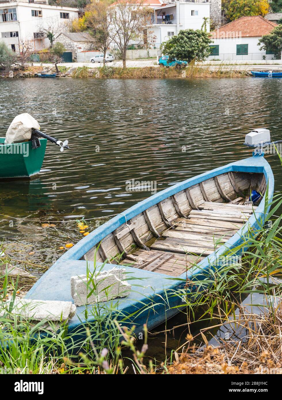 Small fishing boat on the river Neretva. City of Opuzen, Dalmatia region, republic of Croatia Stock Photo
