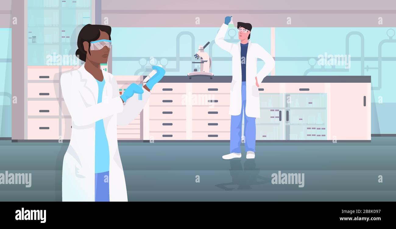 scientists couple holding test tubes working in medical lab mix race