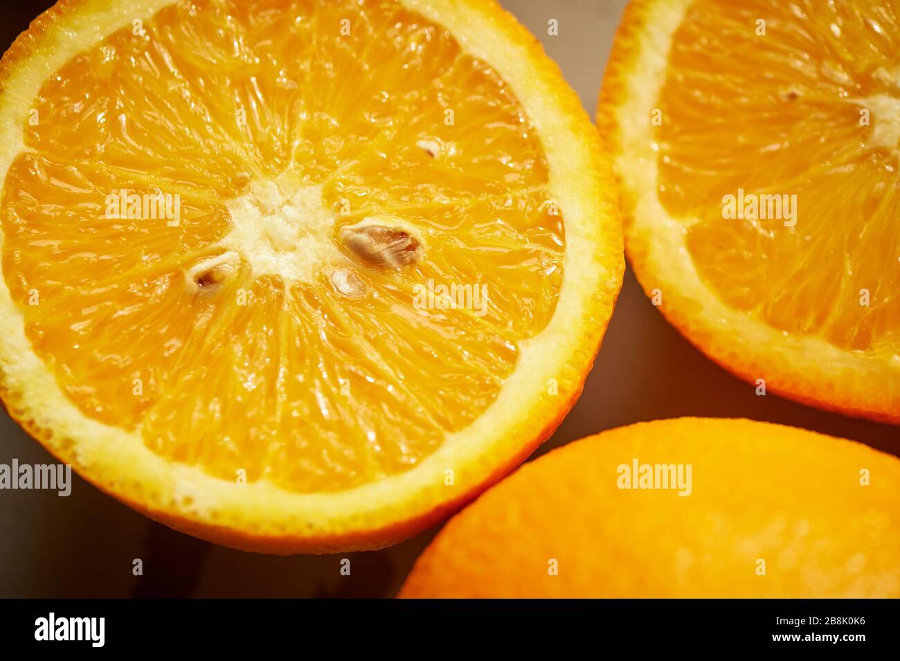 Close-up, cut orange with seeds.Juicy raw food. Stock Photo