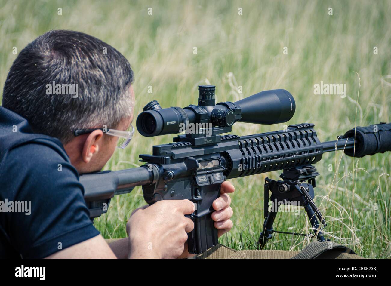 Man using automatic snipers rifle. Weapons training and live firing on