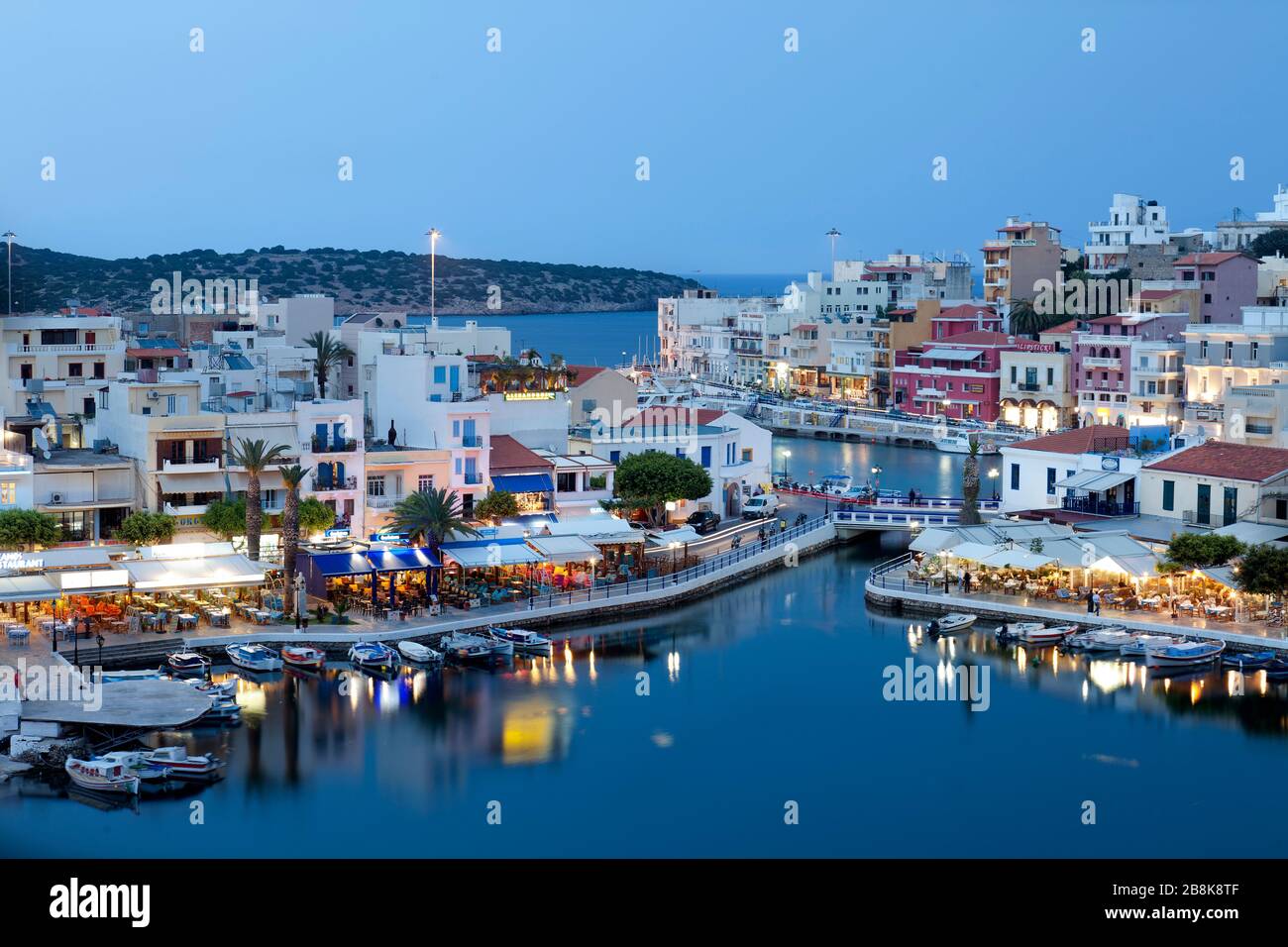 Night view of Agios Nikolaos port .Crete,Greece. Stock Photo