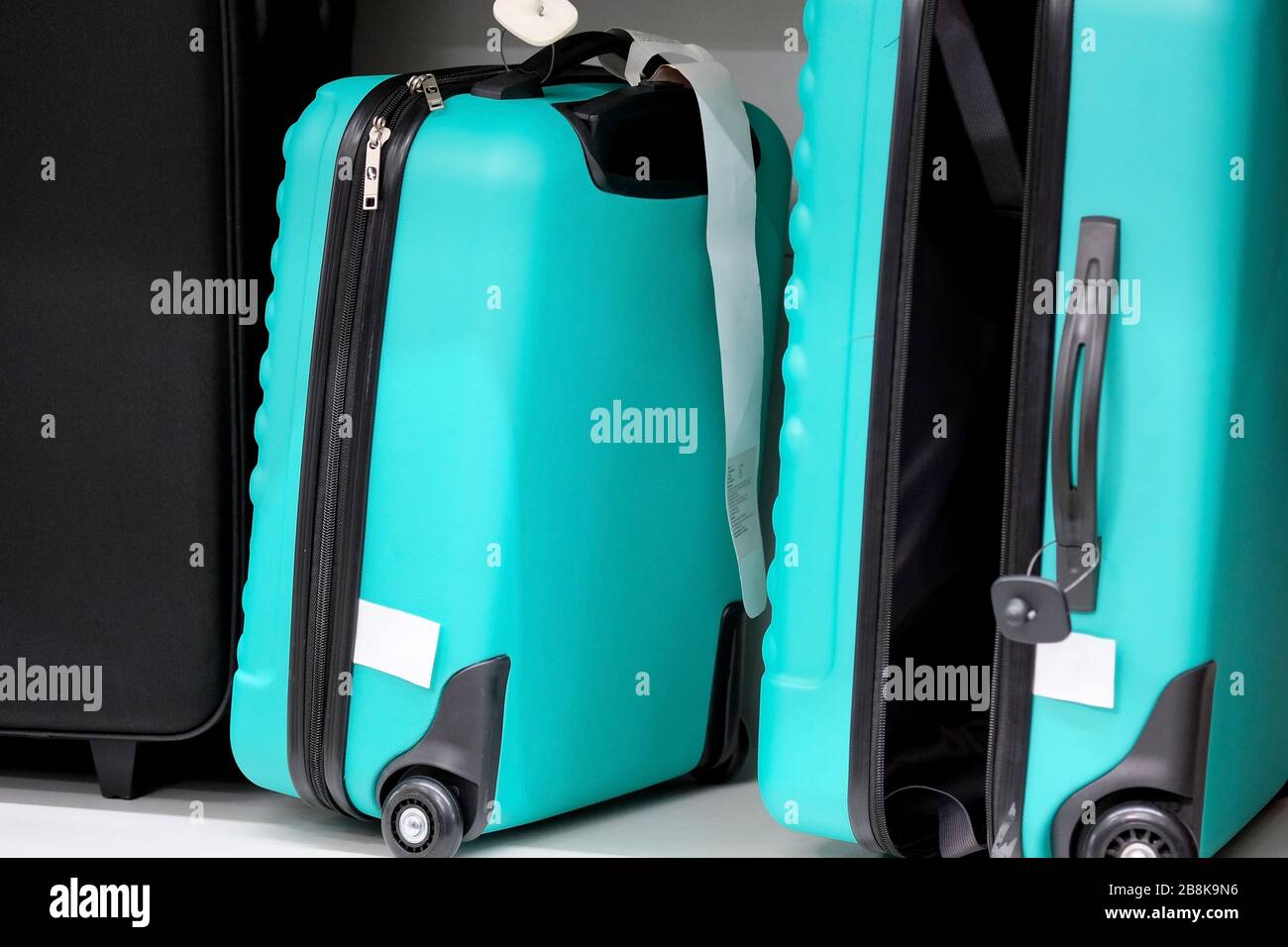 colored plastic suitcase for travel. an open suitcase is standing on a