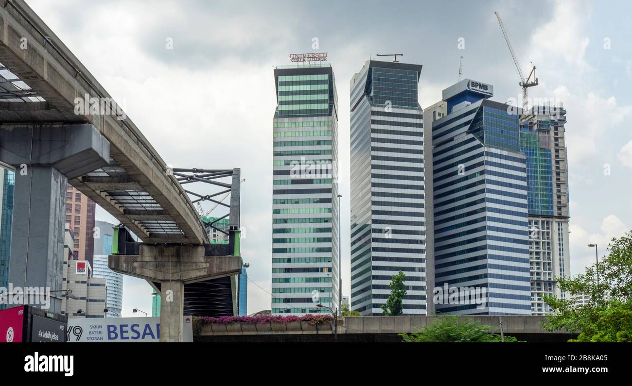 KL Monorail Line by three office towers University Kuala Lumpur DBKL Tower 3 and BPMB Tower in Bandar Wawasan Kuala Lumpur Malaysia. Stock Photo