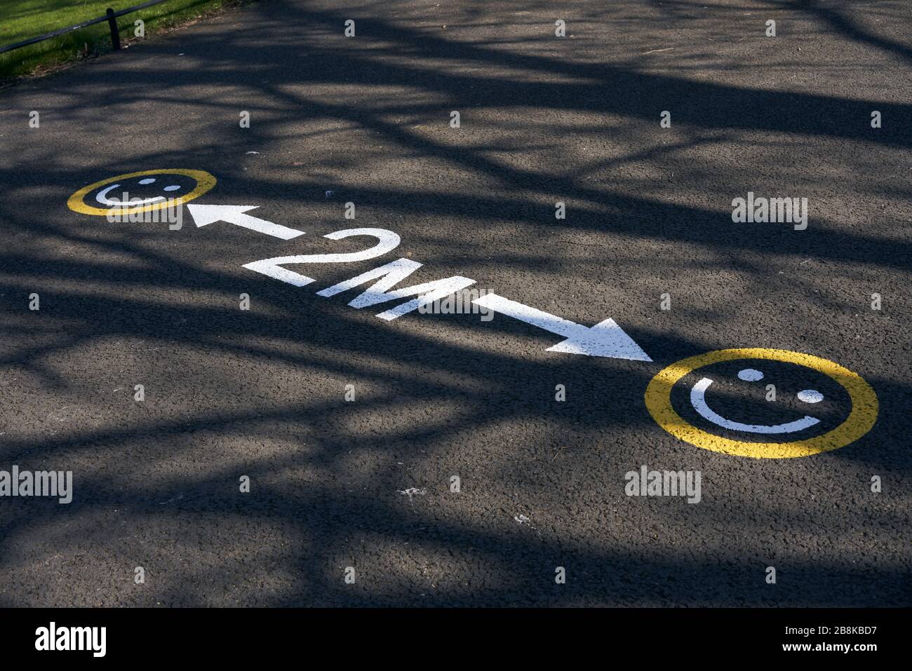 A sign indicating social distancing in the Phoenix Park, Dublin, during the global coronavirus pandemic. Stock Photo