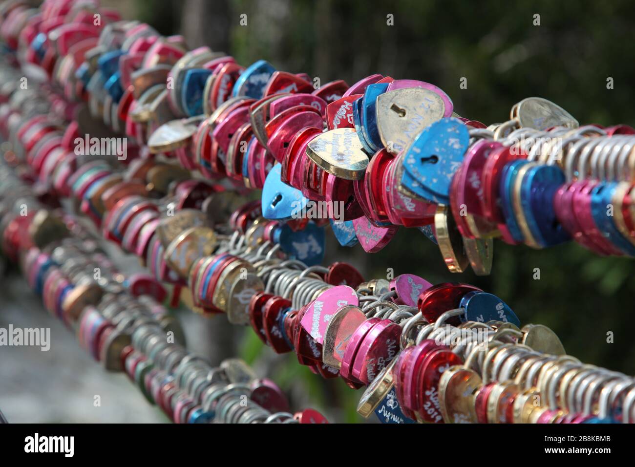 Display of romantic love padlocks, or love locks, attached to fence  at the top of mountain in Langkawi, Malaysia Stock Photo