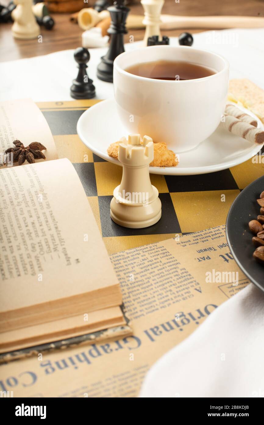 A book,a cup of tea and a chess rook Stock Photo