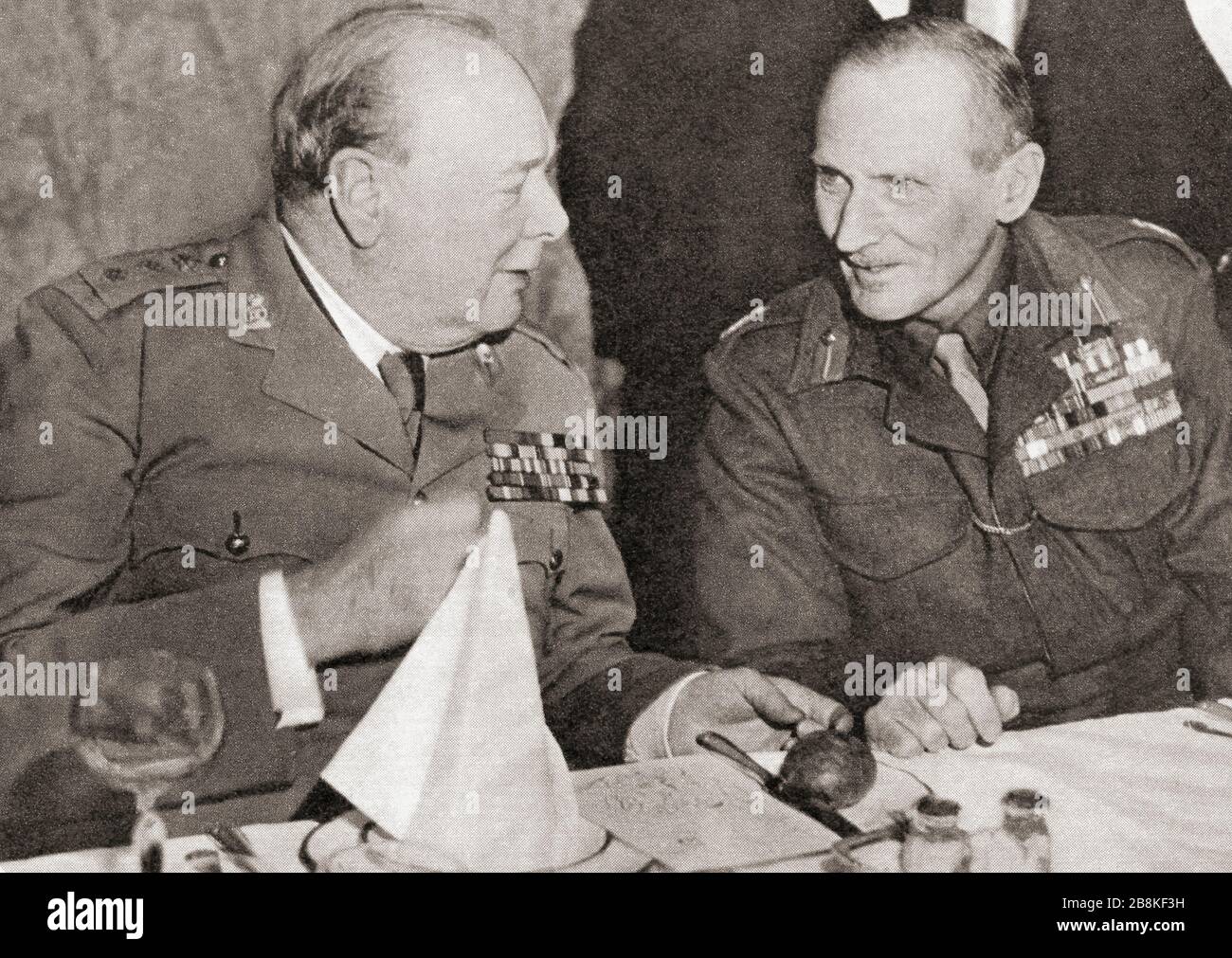 Winston churchill and Field Marshal Montgomery at the First Alamein Dinner, 1945. Sir Winston Leonard Spencer-Churchill, 1874 – 1965. British politician, army officer, writer and twice Prime Minister of the United Kingdom.  Field Marshal Bernard Law Montgomery, 1st Viscount Montgomery of Alamein, 1887 – 1976, nicknamed Monty and The Spartan General.  Senior British Army officer Stock Photo