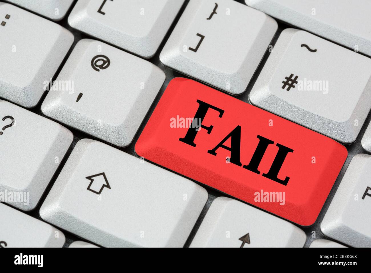 A keyboard with the word FAIL in black letters on a red enter key. Exan concept. England, UK, Britain Stock Photo