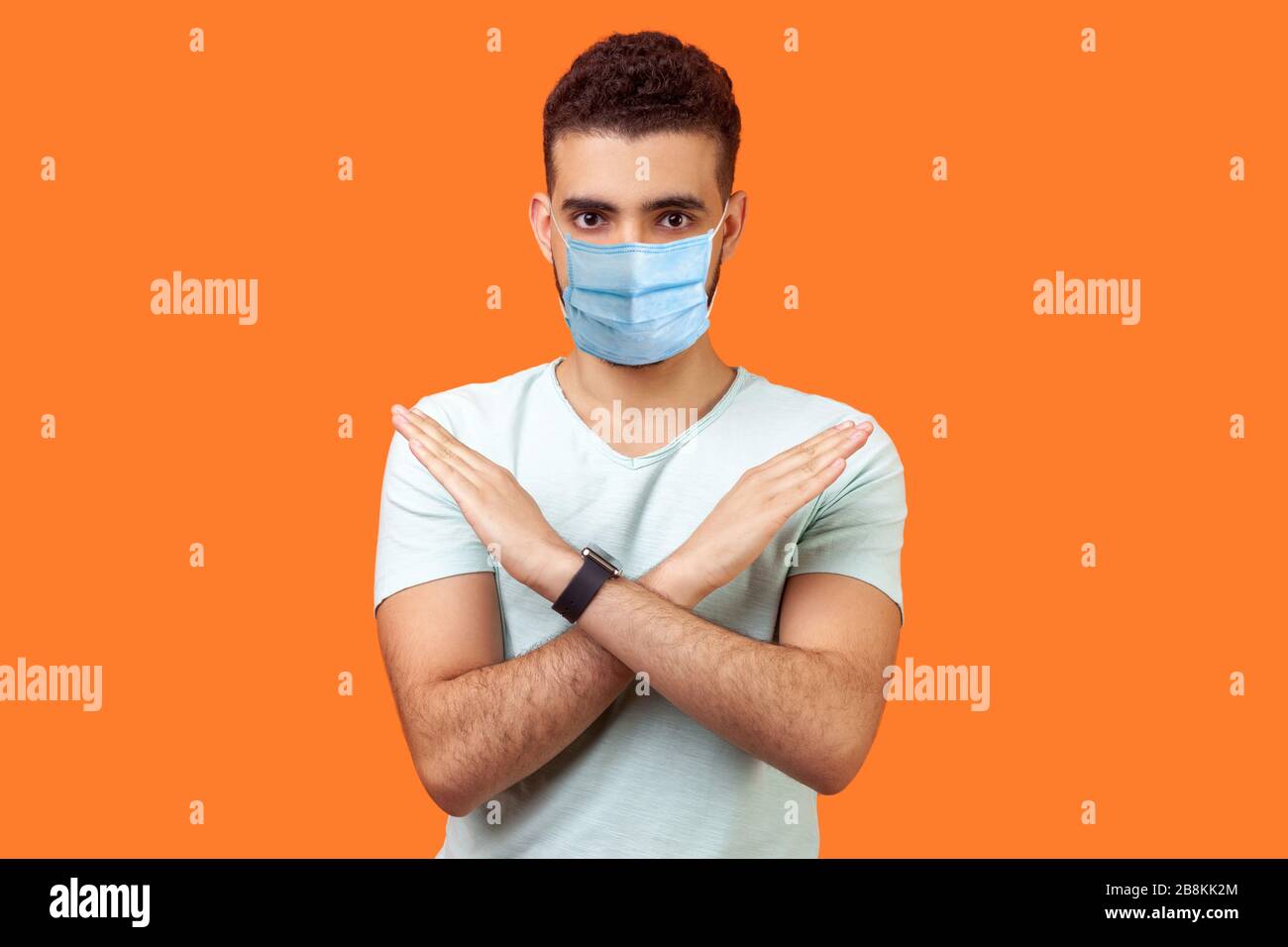 No Way Absolutely Not Portrait Of Determined Man With Medical Mask In White T Shirt Showing X Sign With Crossed Hands Meaning Stop This Is The End Stock Photo Alamy