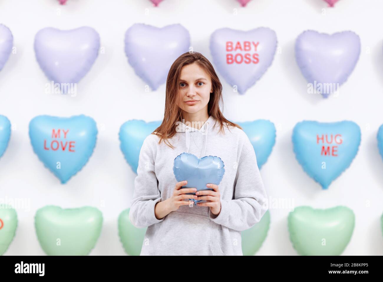 Beautiful Young Woman Holds The Blue Balloon In The Form Of A Heart Many Hearts Background Valentines Day Baby Shower Selective Focus Stock Photo Alamy