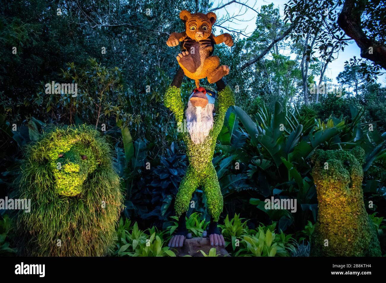 Orlando, Florida . March 11, 2020. Rafiki monkey and Simba topiaries on forest scenery at Epcot in Walt Disney World Stock Photo