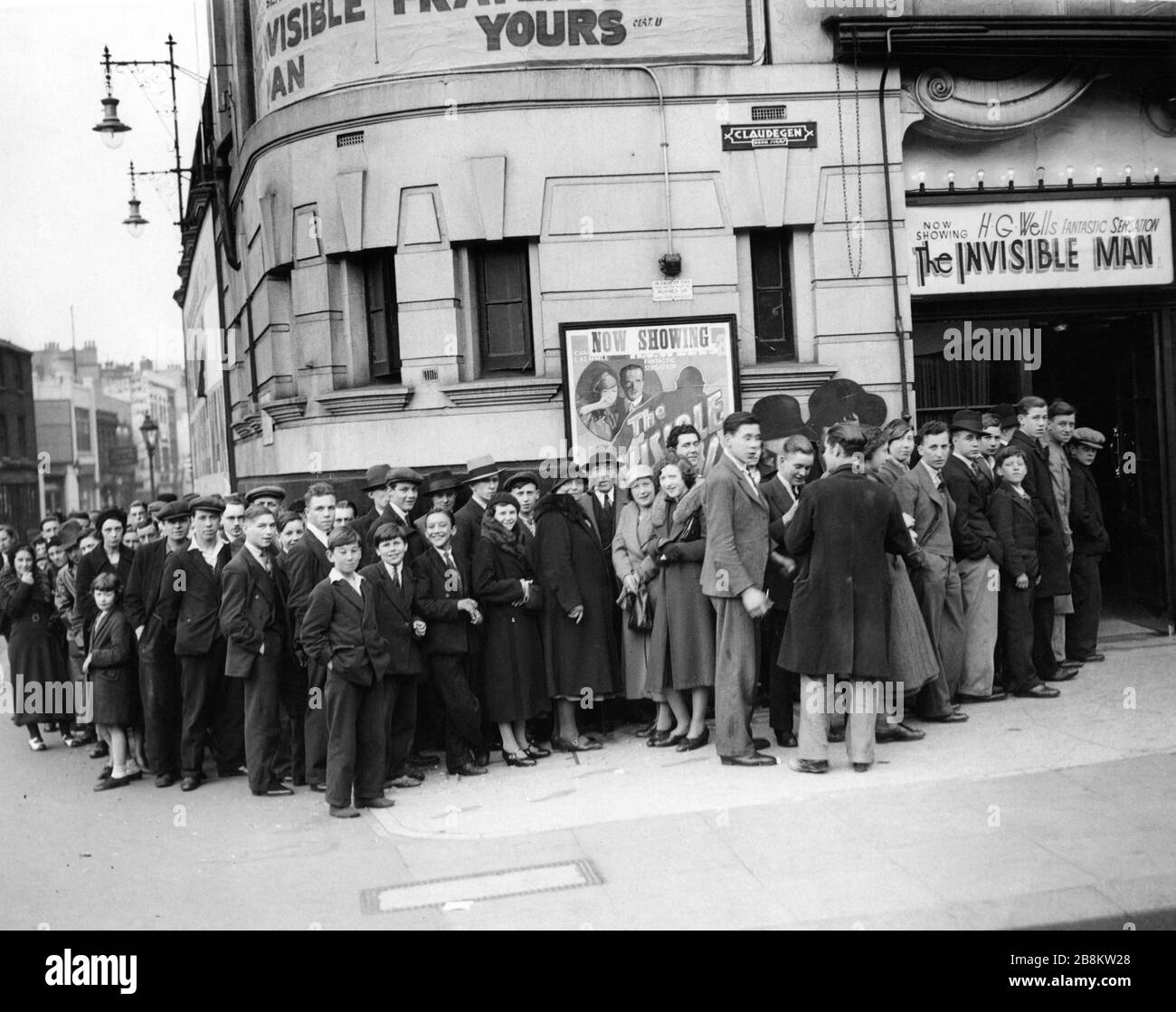 Moviegoers queuing at Brixton London cinema in May 1934 to see CLAUDE RAINS as THE INVISIBLE MAN 1933 director JAMES WHALE novel H. G. Wells screenplay R. C. Sherriff Universal Pictures Stock Photo