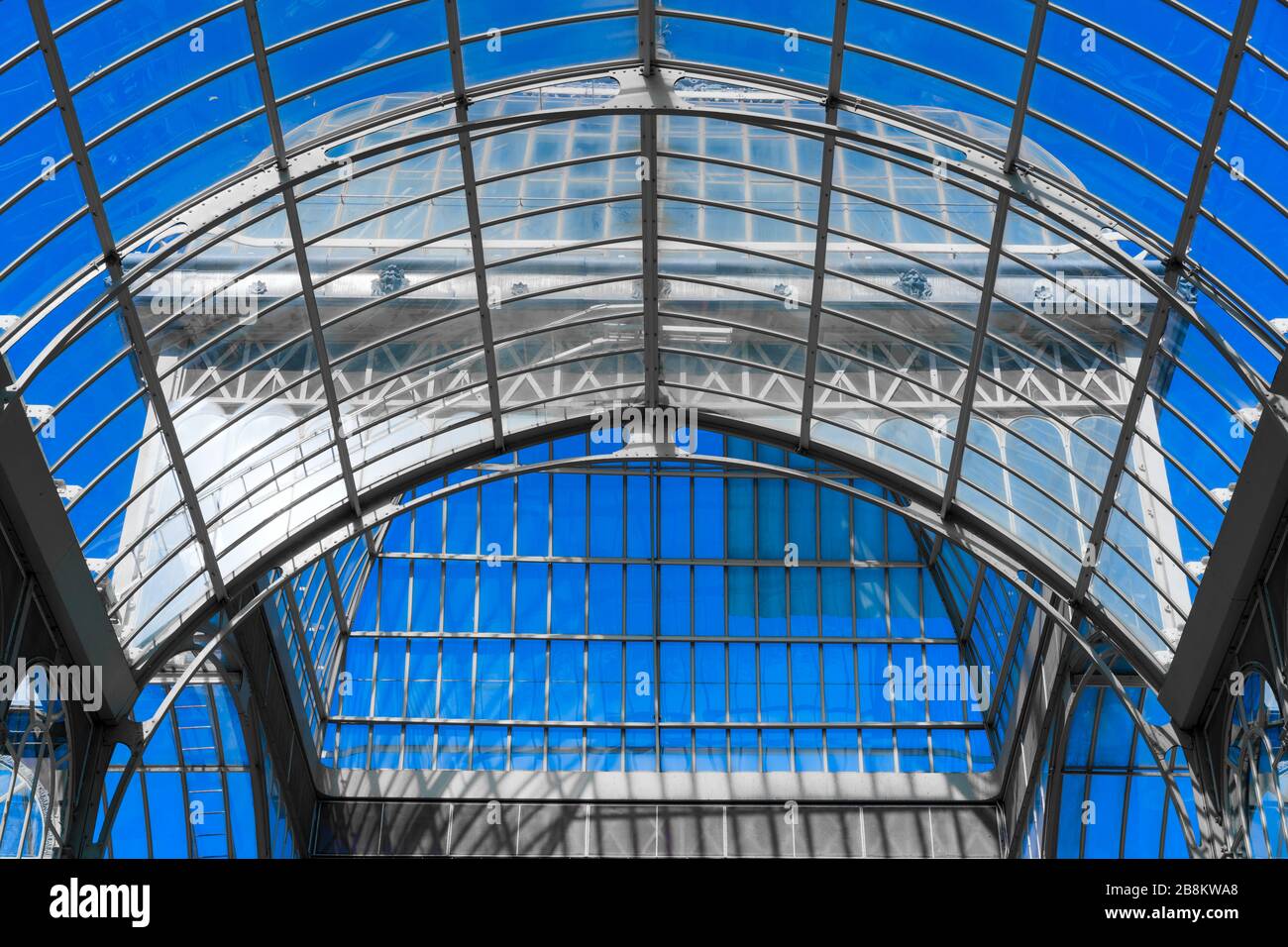 interior of greenhouse in garden with transparent glass roof Stock Photo