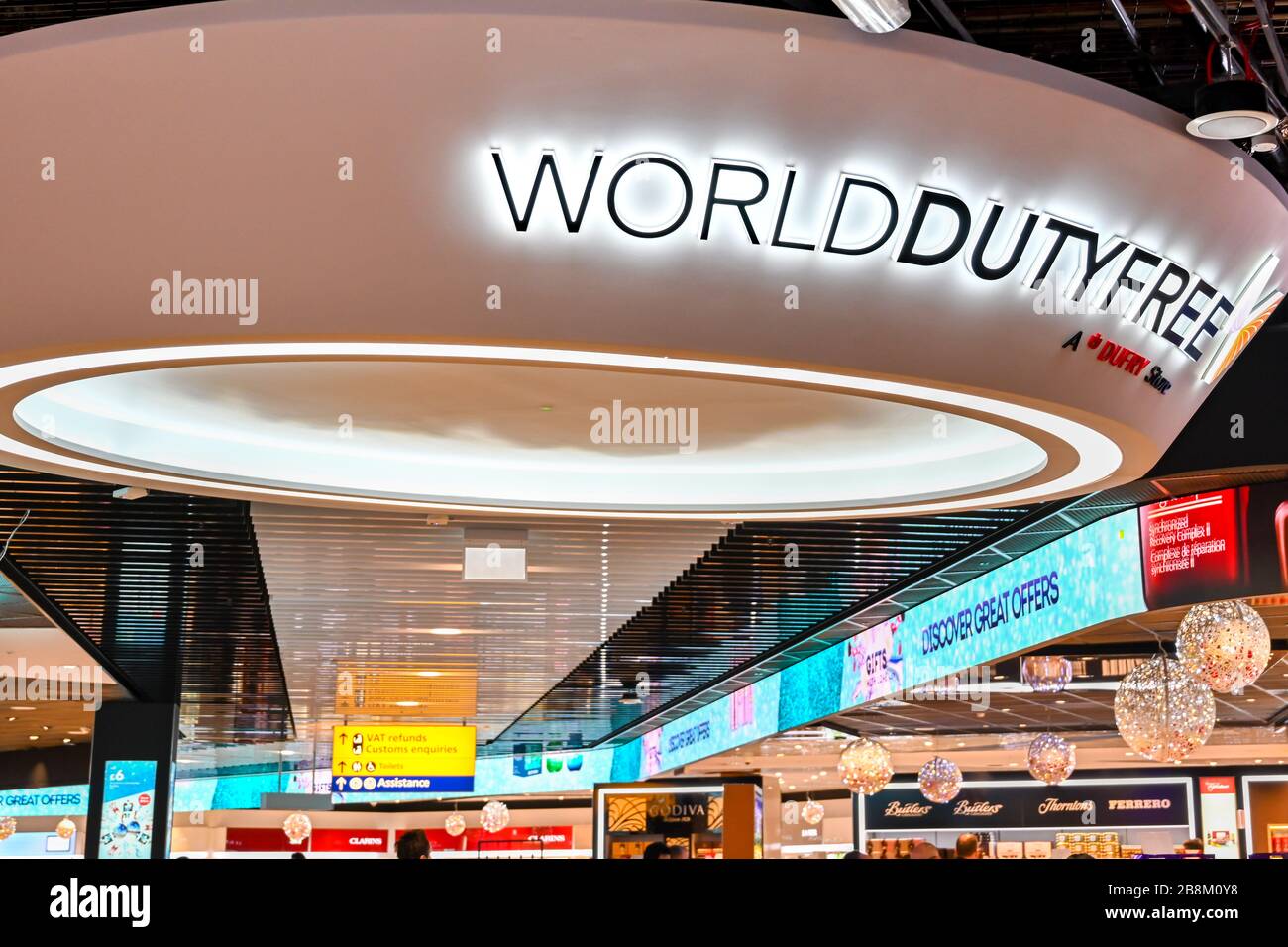LONDON HEATHROW AIRPORT, ENGLAND - NOVEMBER 2019: Illuminated sign above the World Duty Free shop in Terminal 3 of London Heathrow Airport. Stock Photo