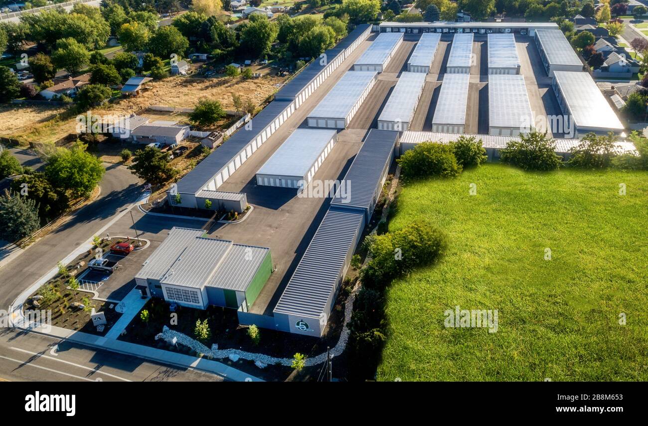 Many small garages in a mini storage unit complex Stock Photo - Alamy
