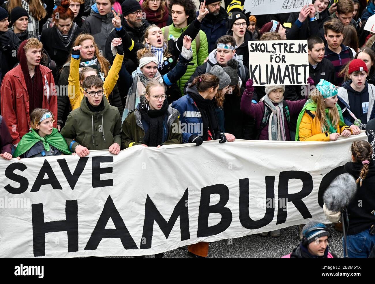 GERMANY, Hamburg city, Fridays for future movement, Save the Climate rally with 30.000 protesters for climate protection, in first row, swedish activist Greta Thunberg with her banner skolstrejk för klimatet, / DEUTSCHLAND, Hamburg, Fridays-for future Bewegung, Demo fuer Klimaschutz, Greta Thunberg mit ihrem Plakat skolstrejk för klimatet, 21.2.2020 Stock Photo