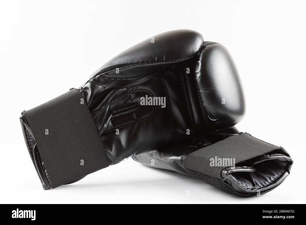 Black insulated white boxing gloves. sports product photography Stock Photo