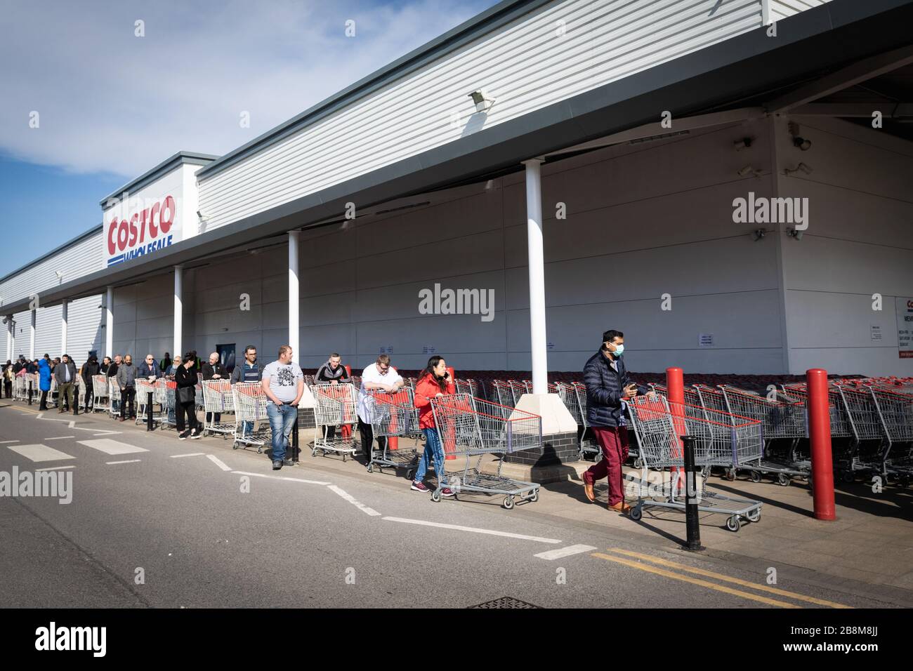 Photograph of people queuing outside of Costco in West Thurrock