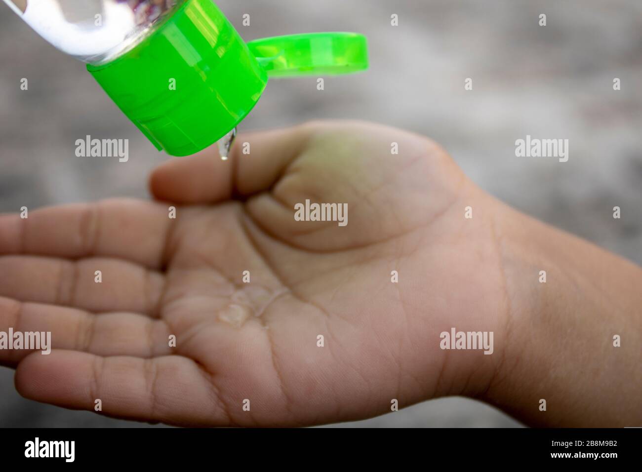 Cleaning hand with sanitizer for protection from virus Stock Photo