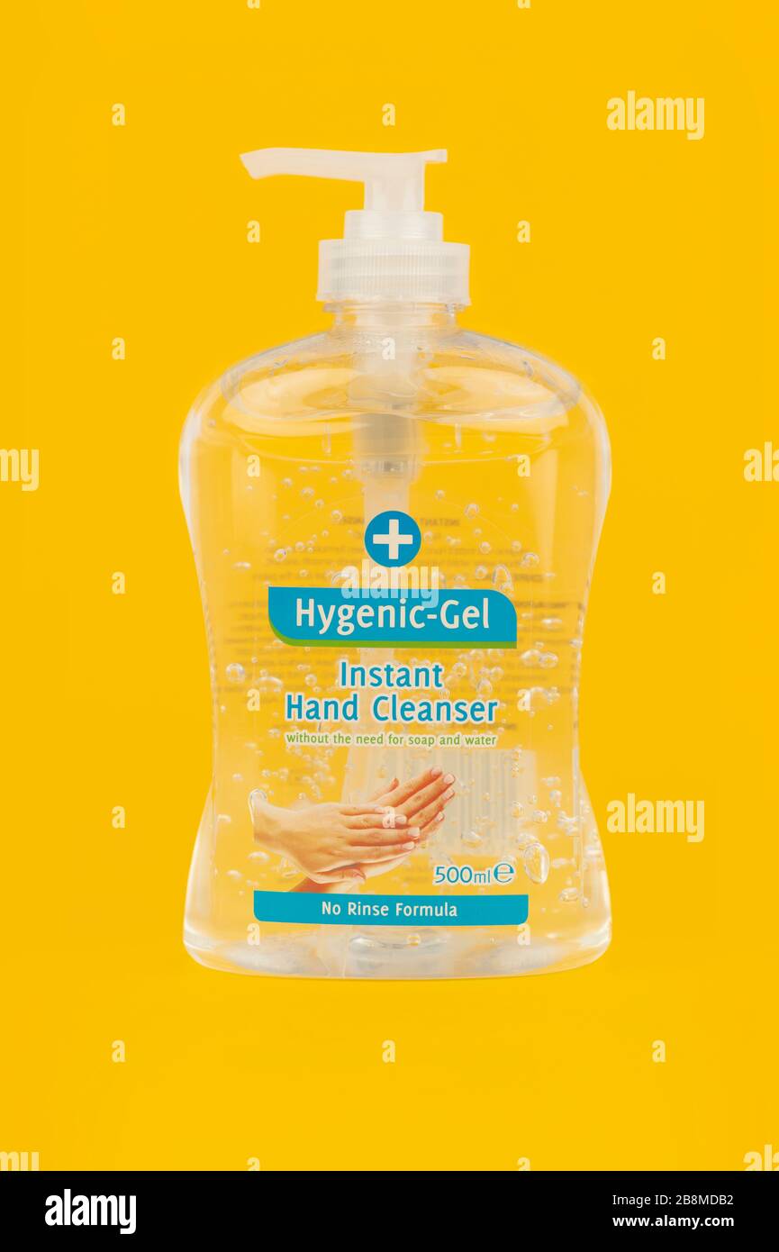 A bottle of hand sanitizer shot on a yellow background. Stock Photo
