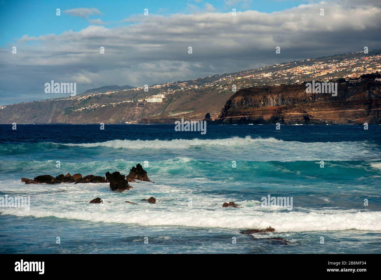 Los gigantes cliffs and waves in front of the beach in Puerto de la Cruz, Tenerife Island, Canary Islands, Spain Stock Photo