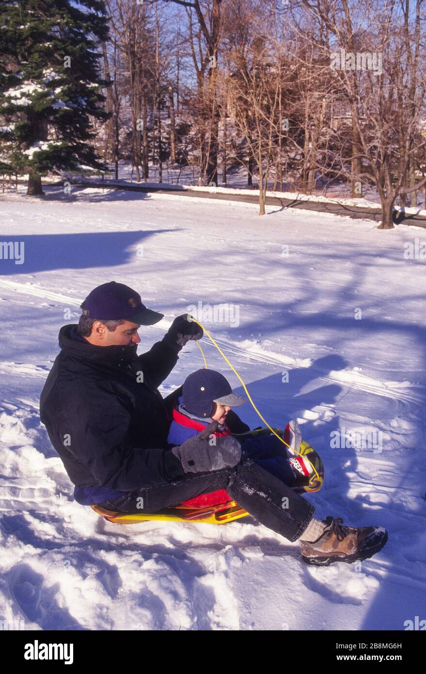 Father and Toddler on sled Stock Photo