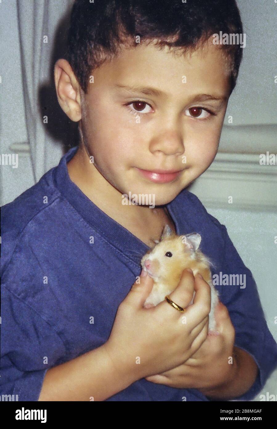 Young boy with hamster Stock Photo