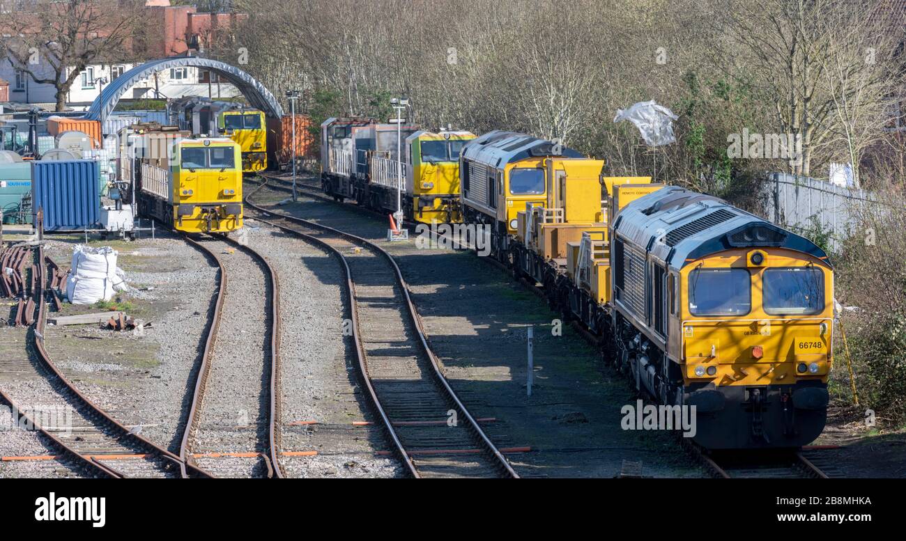 British Rail GB Railfreight service locomotives including Class 66 West Burton 50 - 66748 - at Totton Railway sidings Totton, Hampshire, England, UK Stock Photo